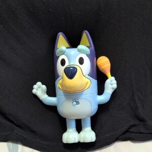 Blue and Purple Action Figure with Maraca